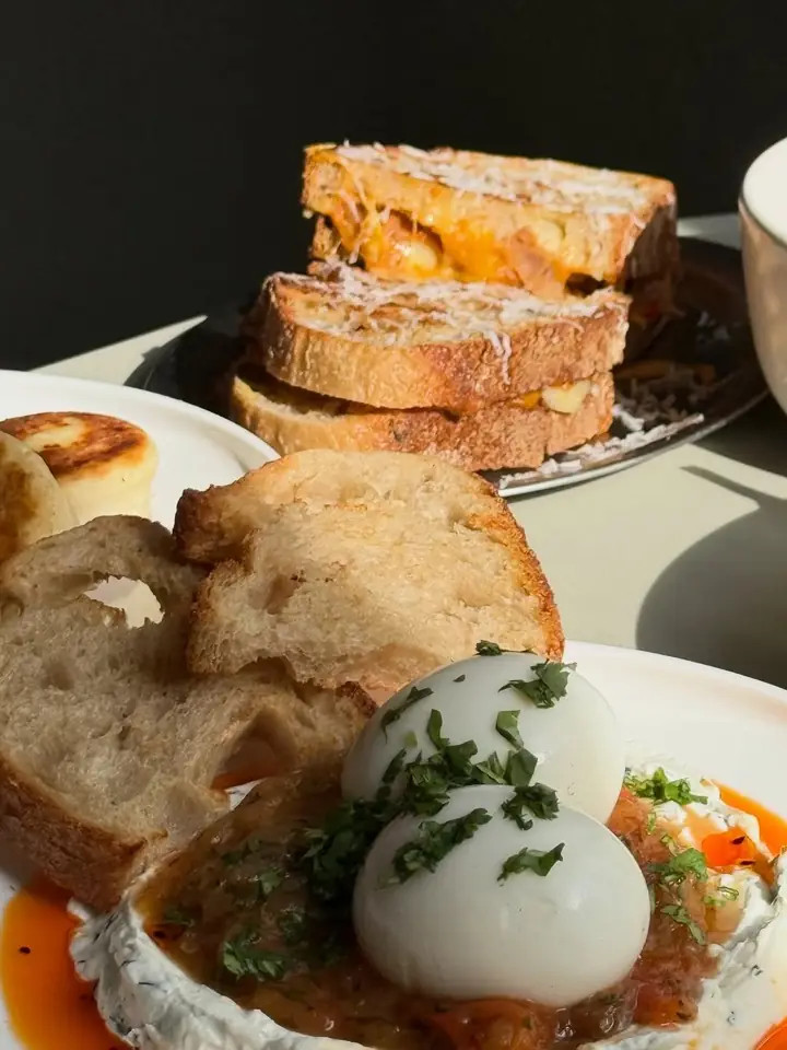 Turkish eggs with chili oil, sourdough and grilled cheese sandwiches